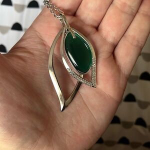 long green necklace with silver earrings